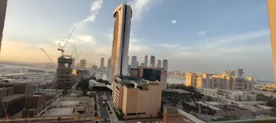 a view of a city with a tall building at Marina Crown 1 BR Modern Apartment Full Sea View in Dubai