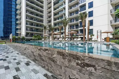 a swimming pool in the middle of a building at Stylish and Versatile for Business or Leisure in Dubai
