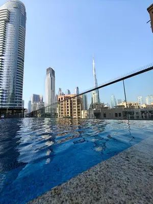 a swimming pool with a view of the city at Luxurious apartment in Downtown, Dubai in Dubai