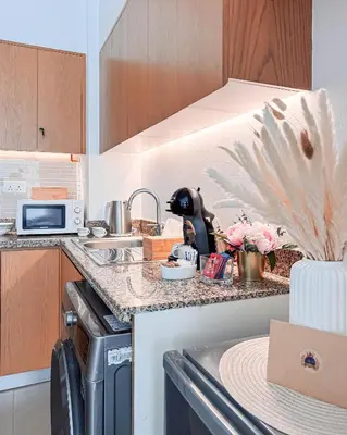 a kitchen with a sink and a dishwasher at Luxurious apartment in Downtown, Dubai in Dubai