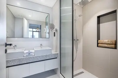 a bathroom with a sink and a shower at Modern Home with Incredible View & Private Beach in Dubai