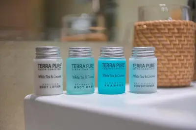 a group of four glass jars sitting on a table at UrbanHomes - Cozy, Wooden and Travel Eco-Friendly Studio in Dubai