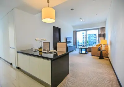 a living room with a reception counter in a building at Luxury Apartments - Stunning Marina View - 5-Star Hotel Amenities in Dubai