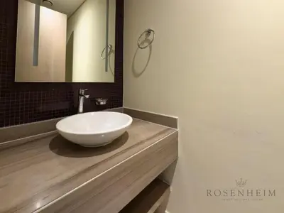 a bathroom with a white bowl sink on a counter at Spacious & Cozy 1BR - Stunning City View in Dubai