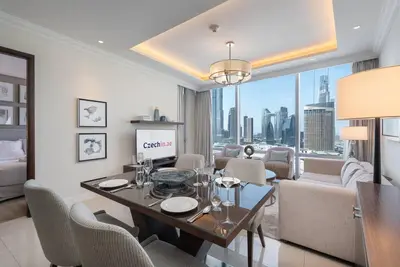 a living room with a dining table and a living room at Luxury Living - Spectacular Burj Khalifa Views in Dubai