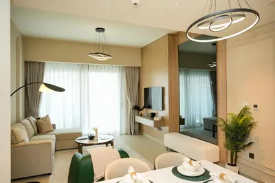 a living room with a couch and a table at Chic 1BR Retreat , Blvd Views, Walk to Dubai Mall in Dubai