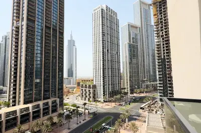 a view of a city with tall buildings at Chic 1BR Retreat , Blvd Views, Walk to Dubai Mall in Dubai