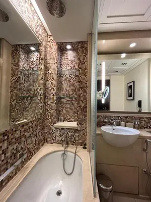 a bathroom with a bath tub and a sink at The Address Downtown Studio 1911 in Dubai