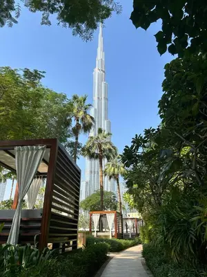 a view of the burj khalifa from a park at The Address Downtown Studio 1911 in Dubai