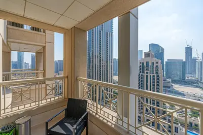 a balcony with a chair and a view of the city at Downtown Studio with Balcony at 29Blvd in Dubai
