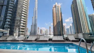 a swimming pool on the roof of a building at UrbanStays Dubai - Act Tower in Dubai