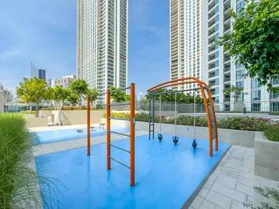 a playground in a city with tall buildings at UrbanStays Dubai - Downtown Views II in Dubai
