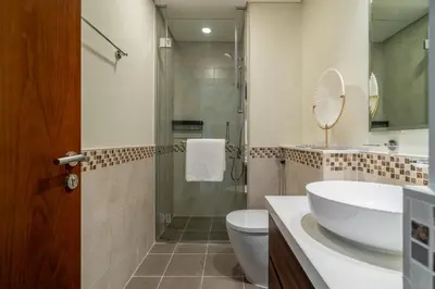 a bathroom with a sink and a toilet and a shower at GuestReady - Charming home in Business Bay in Dubai
