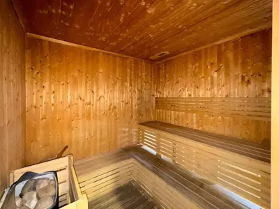 an empty wooden sauna with wooden floors and ceilings at GuestReady - Charming home in Business Bay in Dubai