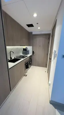 a small kitchen with a sink and a counter at New! Modern cosy Studio Laya Heights in Dubai