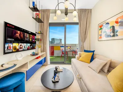 a living room with a couch and a table at Modern High-Floor Apartment with Burj Khalifa View by Dejaview Stays in Dubai