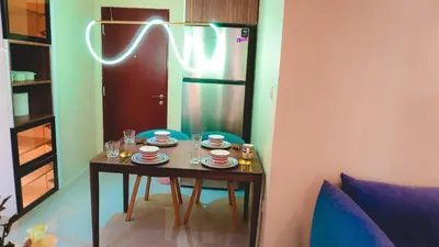 a table with cups and plates on it in a room at USMANS 3 Bedroom Apartment all Rooms Sea View Direct Beach Access Daily HOUSEKEEPING JBR in Dubai