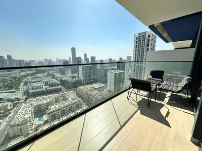 a balcony with a view of a city at Elegant 1br Escape Jvc Pool & Balcony Access in Dubai