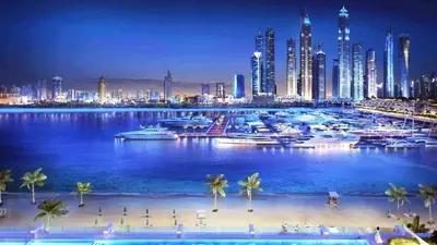 a view of a city with a marina at night at Private Beach & Canal View-Top Location-Pool-Gym in Dubai