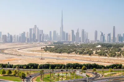 a view of a city with tall buildings at Manzil - 1BR Apartment in Farhad Aziz Residence with Burj View in Dubai