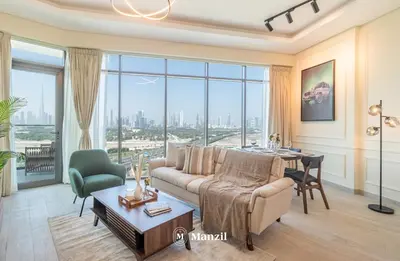a living room with a couch and a table at Manzil - 1BR Apartment in Farhad Aziz Residence with Burj View in Dubai