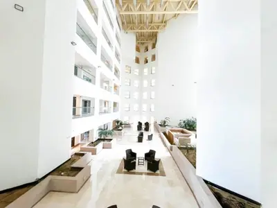 a lobby of a building with chairs and tables at Stunning 2 bedrooms in Sky Gardens DIFC in Dubai
