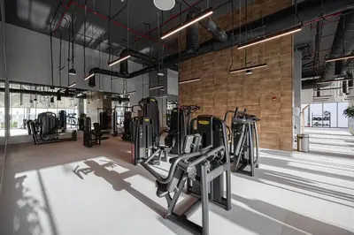 a gym with rows of treadmills and machines at 2Bed-400m from Burj Khalifa- Heart of Dubai in Dubai