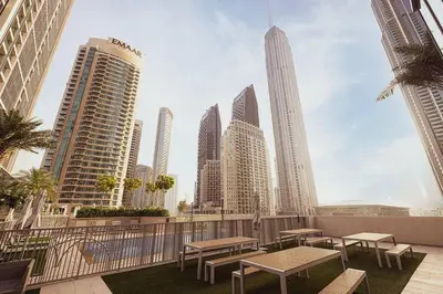 a view of a city skyline with tables and buildings at 2Bed-400m from Burj Khalifa- Heart of Dubai in Dubai
