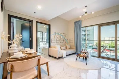 a living room with a couch and a table at Charming 2BR at MAG 515 Dubai South by Deluxe Holiday Homes in Dubai