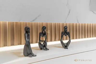 three black statues sitting in a bath tub at 1BR Gem in JVC Pool, Gym, BBQ & Balcony in Dubai