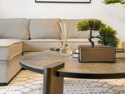 a coffee table in a living room with a couch at Brand New! Dubai Eye & JBR Beach Panorama! in Dubai