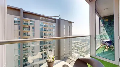 a balcony with a view of a building at Locations I Creek Vistas Reserve I Luxury Calm 1BR I 12 Min Drive to Downtown Dubai & Business Bay I Modern Comfort in Meydan Community in Dubai