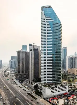 a city with a tall building and a highway at Burj Khalifa View 3bedroom in Dubai