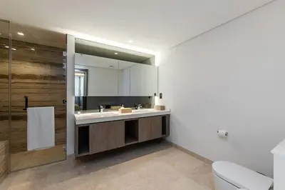 a bathroom with a sink and a mirror at Burj Khalifa View 3bedroom in Dubai