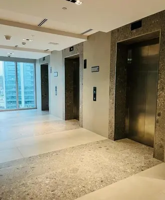 an empty room with a elevator in a building at Elegant Studio Stay near Miracle Garden, Butterfly Garden & Dubai Hills Mall in Dubai