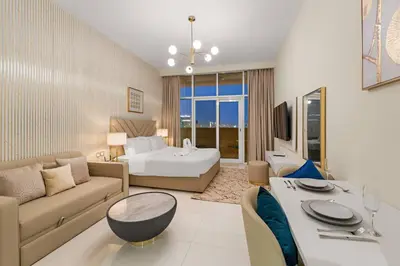 a living room with a couch and a bed and a table at FIRST CLASS Studio Luxury Getaway in Dubai