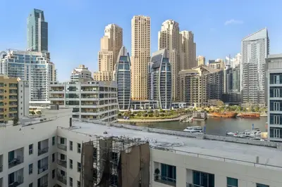 a view of a city with a river and buildings at Royal King Size Stay 2BR With Marina View in Dubai