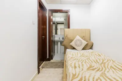 a bedroom with a bed with a zebra print pillow at Luxury 3BR with Stunning Full Marina View in Dubai in Dubai