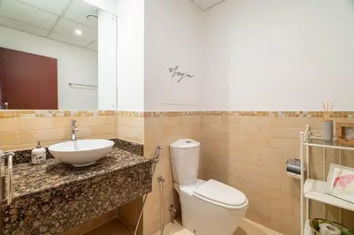 a bathroom with a toilet and a sink at GuestReady - Serene retreat with Ain Dubai Views in Dubai