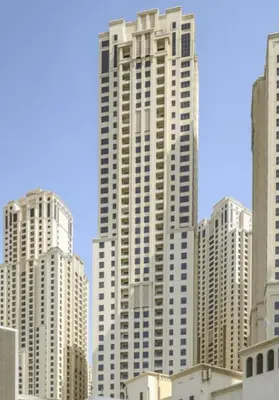 a tall building in a city with tall buildings at GuestReady - Serene retreat with Ain Dubai Views in Dubai