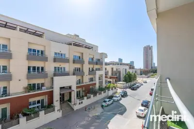 a view from the balcony of a building at Large studio in JVC - Dubai in Dubai