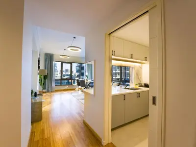 an open kitchen and living room in a apartment at EasyGo- amazing 1bdr with view south ridge- downtown in Dubai