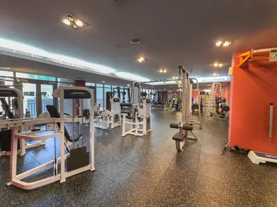 a gym with several treadmills and machines in a room at EasyGo- amazing 1bdr with view south ridge- downtown in Dubai