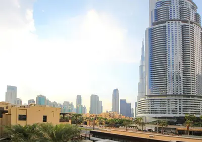 a large skyscraper in the middle of a city at Elegant 2BR Apartment in Yansoon 3 with Burj Khalifa Views in Dubai
