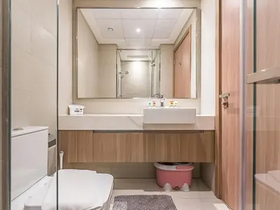 a bathroom with a sink and a mirror at Relaxing Studio Retreat in Vibrant Meydan City in Dubai