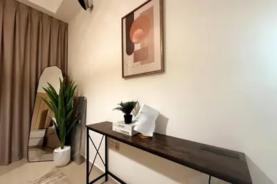 a room with a table and a picture on the wall at Stunning Newly Furnished Apartment Dubai Marina in Dubai