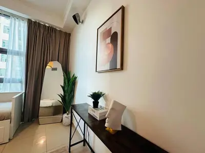 a living room with a table in front of a window at Stunning Newly Furnished Apartment Dubai Marina in Dubai