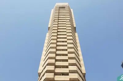 a tall building with a blue sky in the background at Marina, Beach & Mall Walking Dis in Dubai