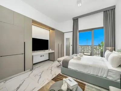 a bedroom with a large bed and a large window at Sukoon's Elegant Suite 2 in Dubai