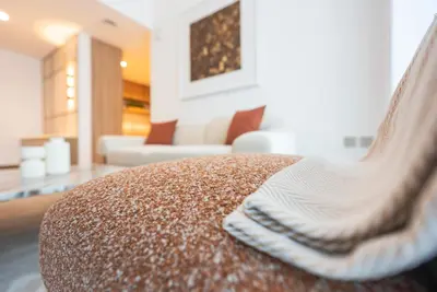 a pair of socks sitting on top of a couch at Luxury 1 & 2 BHK Apartments, Branded & State of The Art Amenities in Dubai